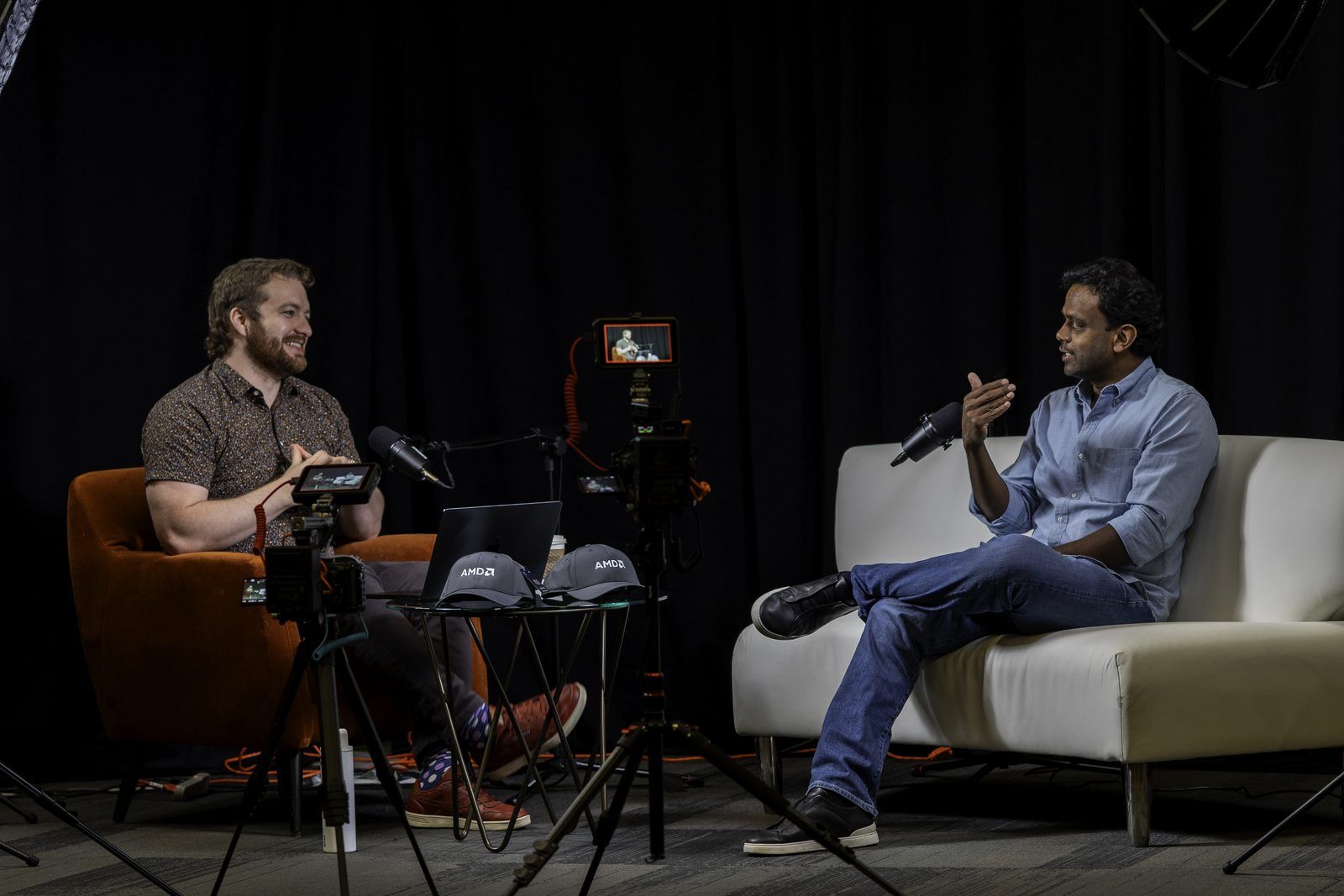 Conor Bronsdon recording a Chain of Thought episode with a guest on a full studio camera and lighting setup