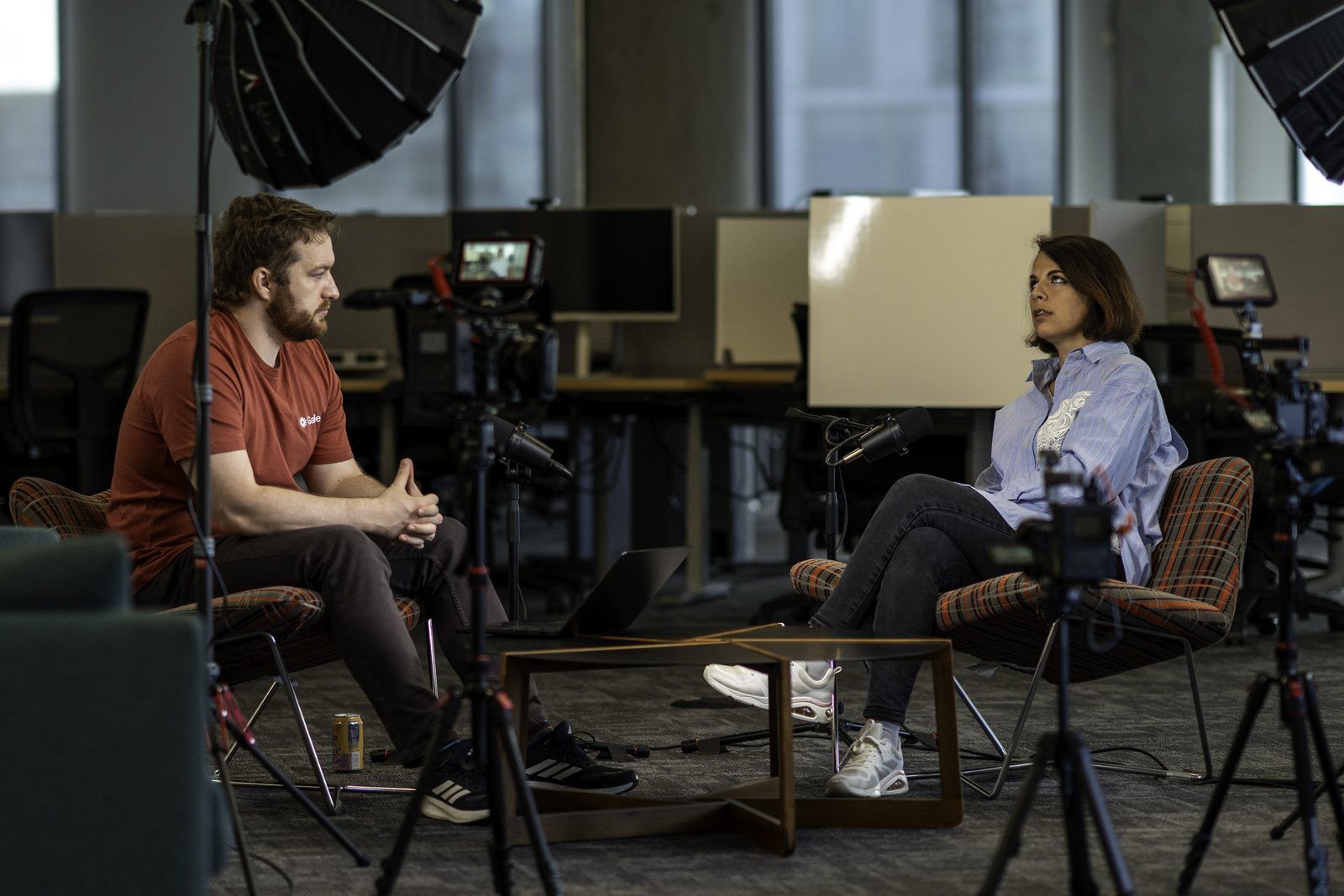 Conor Bronsdon recording a Chain of Thought episode on location with a guest, on a full camera and lighting setup